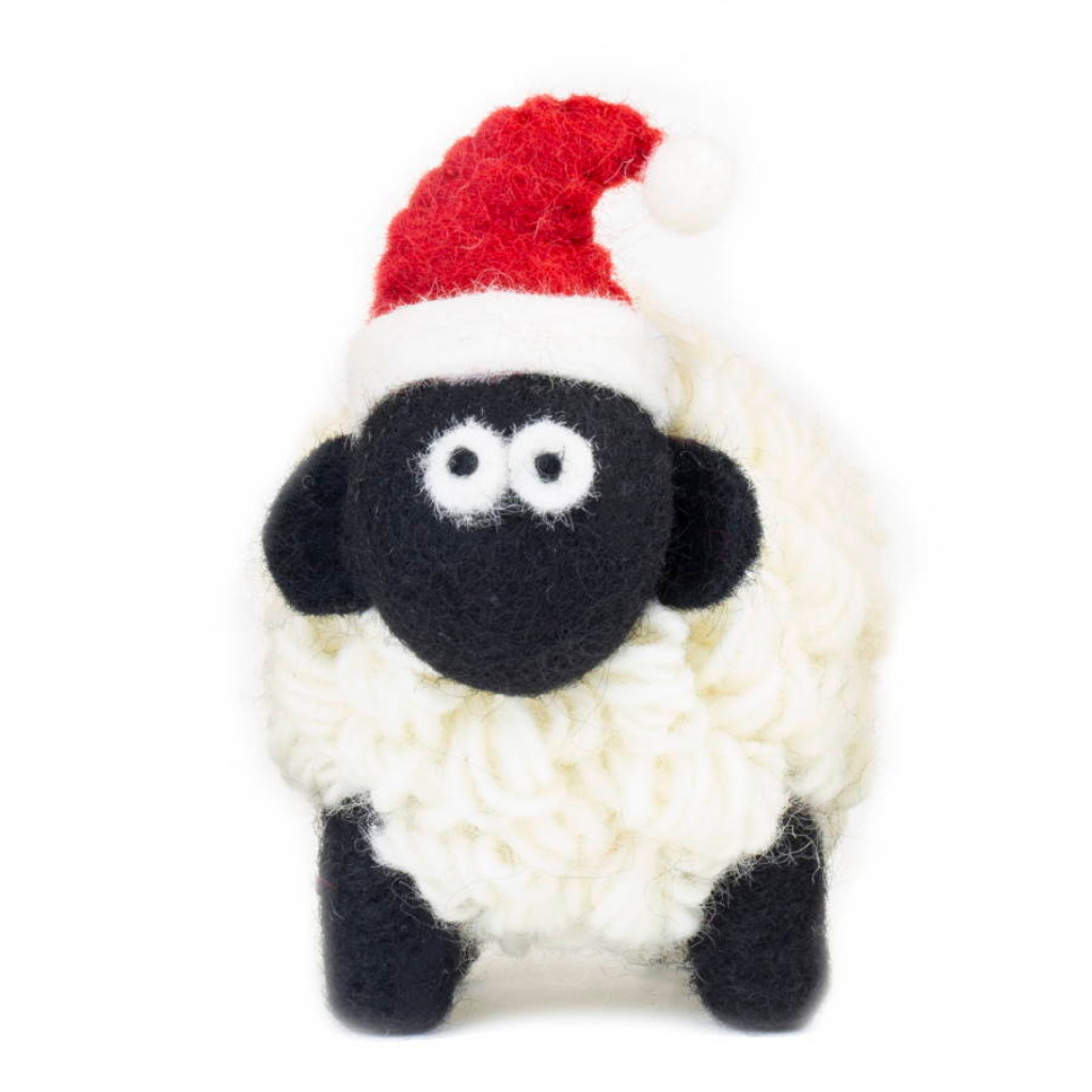 Handcrafted knitted sheep collectible wearing a Santa hat, made from Irish Aran wool