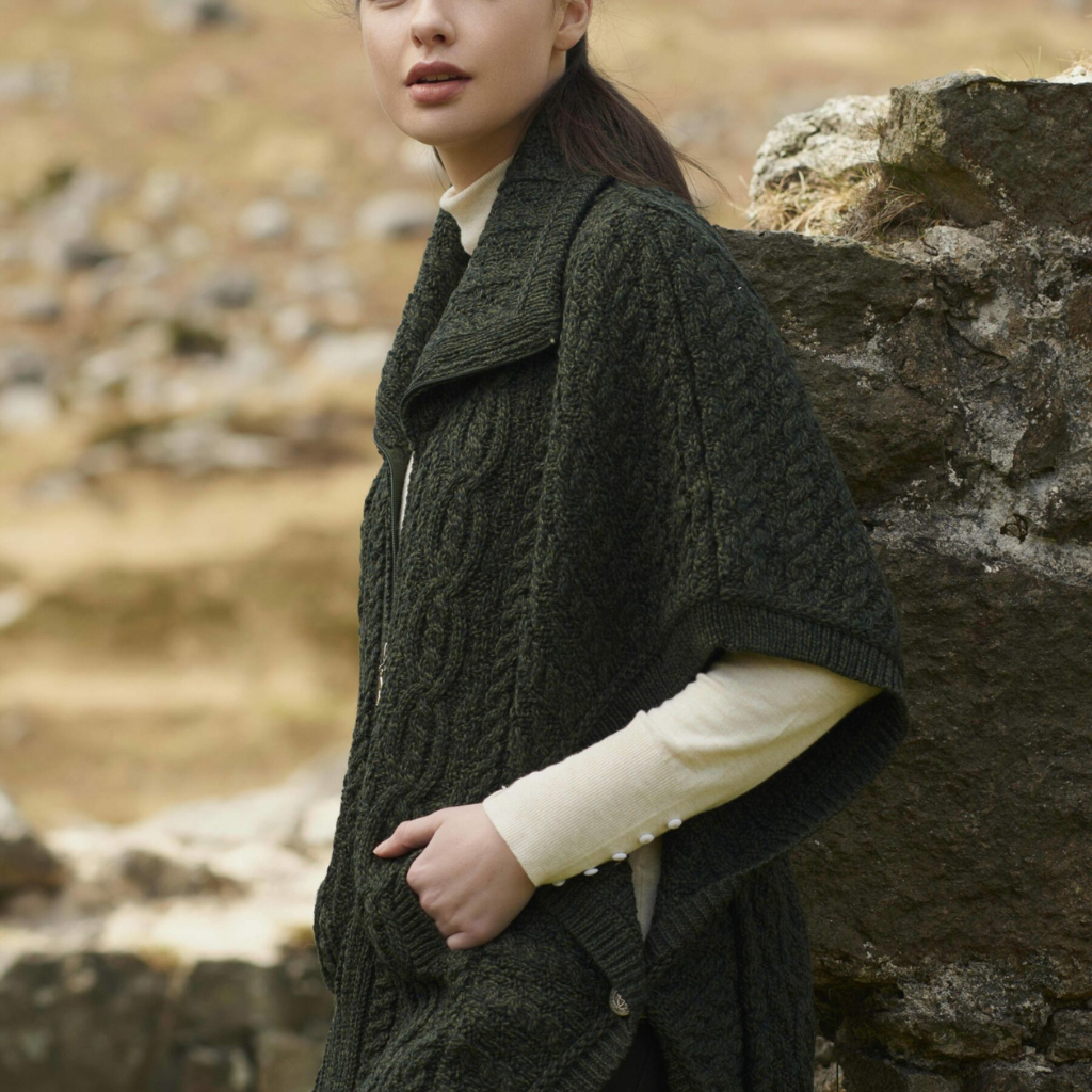 Side view of Aran Funnel Neck Jacket in Army Green with batwing sleeves and button detail.