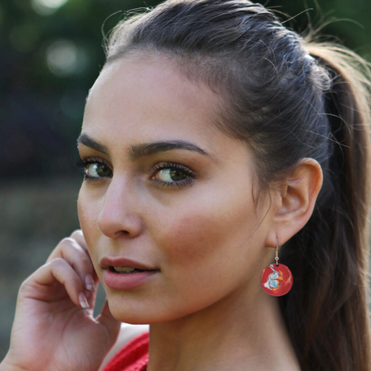 Woman wearing Cotopaxi Red Drop Earrings – bold Irish handmade design