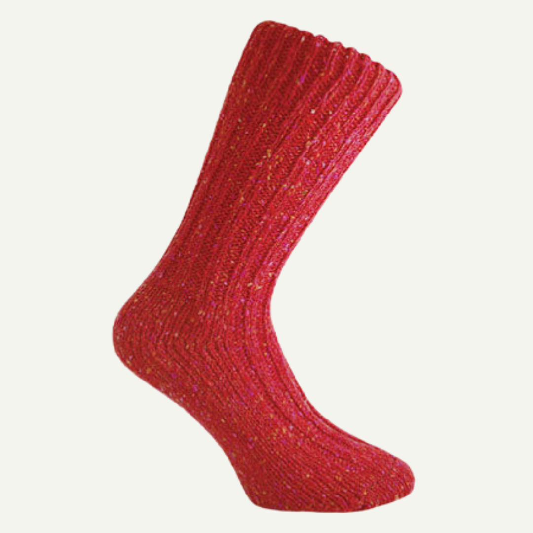 Red Donegal wool socks with flecked wool texture on off-white background
