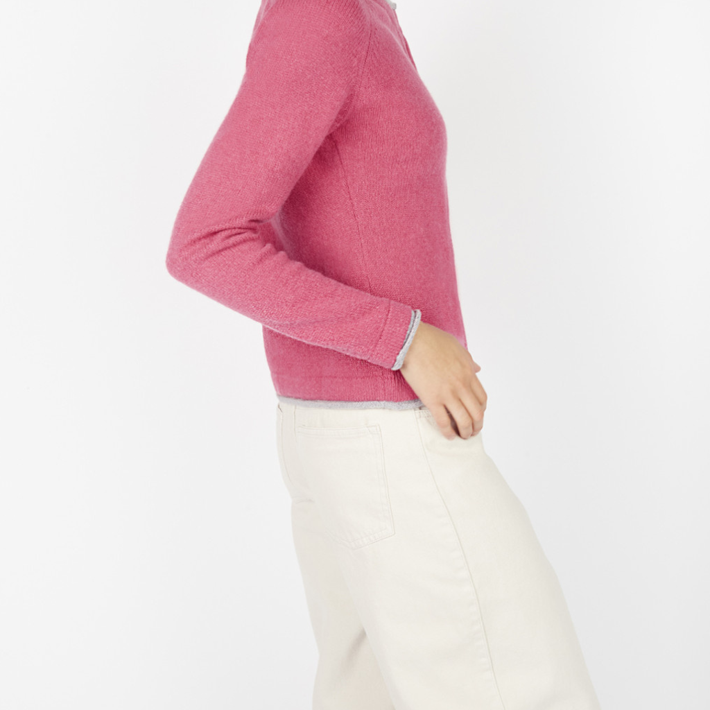 Side profile of Killiney Button Cardigan in rose pink with long sleeves and contrast edging