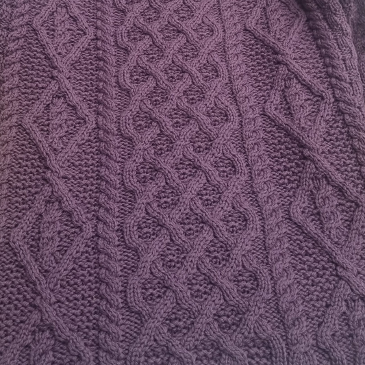 Close-up of Lambay Lattice Cable Aran Sweater in Warm Lavender showing lattice and cable stitches