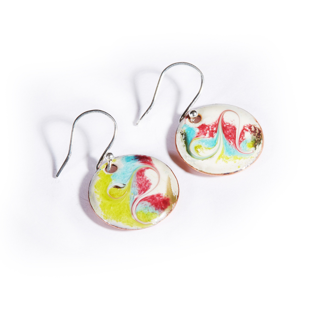 Close-up of Leia Cream Drop Earrings showing unique cream enamel swirl design