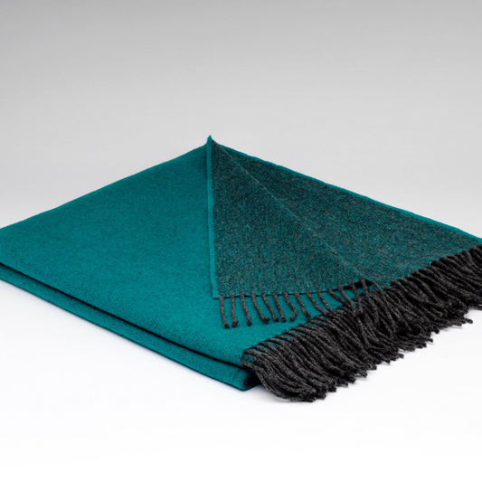 Folded McNutt Tropical Green Reversible Throw with charcoal tassels, woven in Donegal from 100% merino lambswool