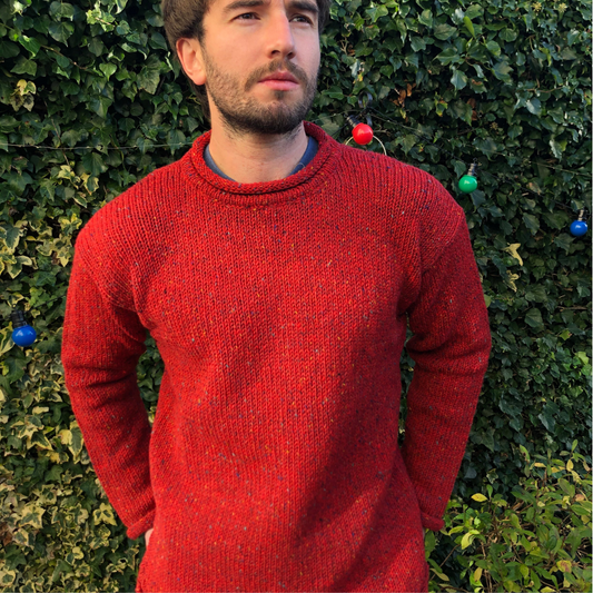 Unisex roll neck fisherman sweater in red flecked Donegal wool