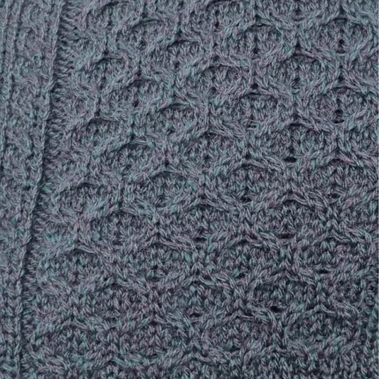 Close-up of Blackwatch Aran sweater showing honeycomb stitch and cable knit detail
