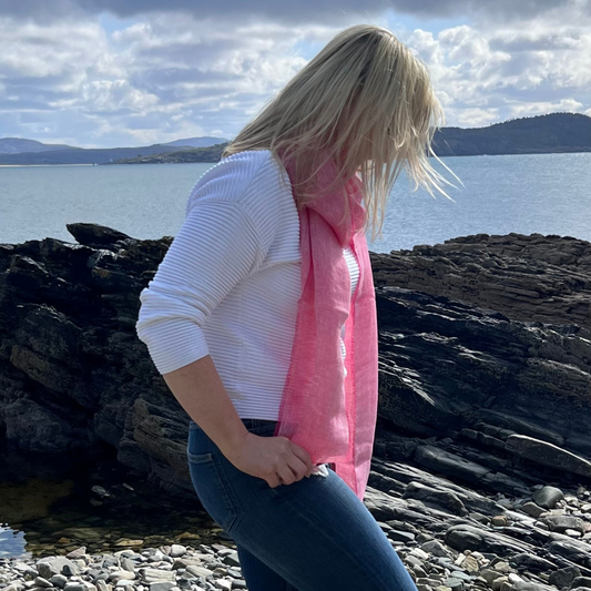 Woman wearing McNutt fuschia herringbone Irish linen scarf outdoors