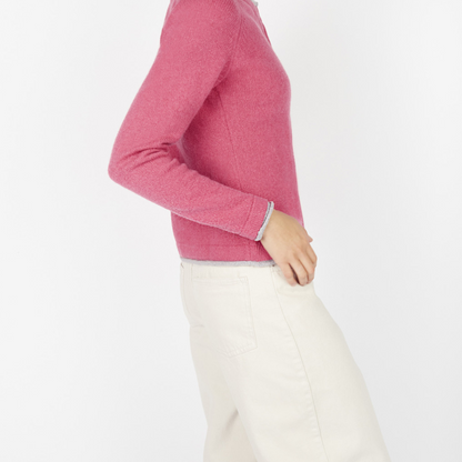 Side profile of Killiney Button Cardigan in rose pink with long sleeves and contrast edging