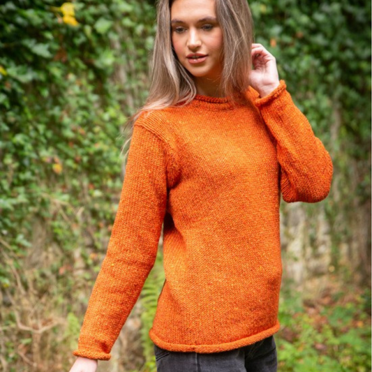 Woman wearing hand-loomed burnt orange wool roll neck tunic, made in Donegal