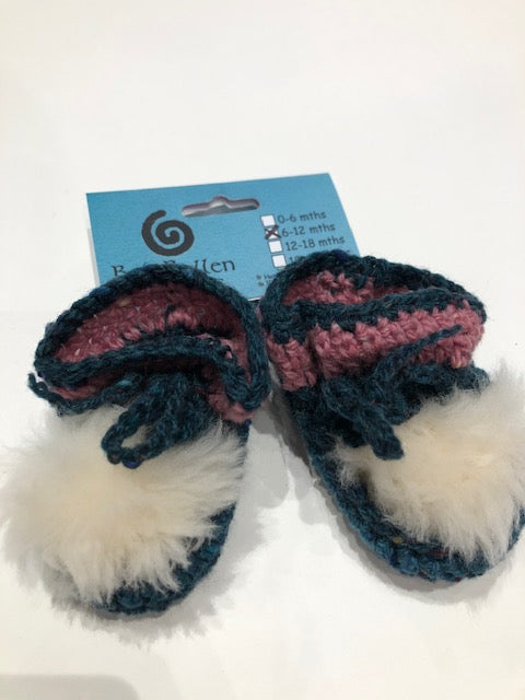 Hand knitted baby boots with turquoise and pink trim