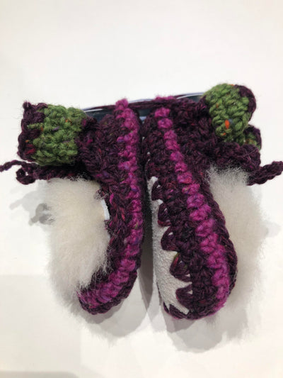 Side View Of Purple and Green Baby Shoes